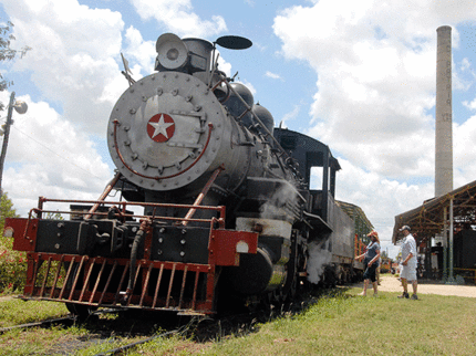 Go through the sugar cane plantations in a train drawn by an old steam locomotive, Morón